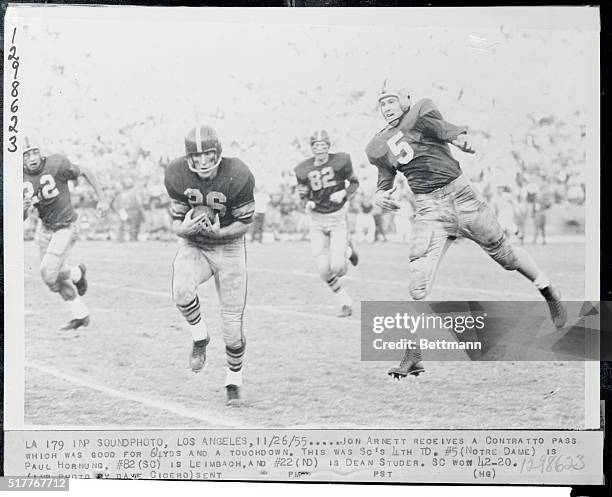 Jon Arnett receives a contratto pass which was good for 64 yards and a touchdown. This was SC's 4th TD. #5, is Paul Hornung, #82, , is Leimbach, and,...