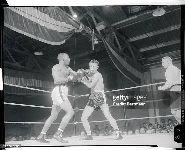 Washington, D.C.: Cherif Hamia, French featherweight champion outpointed Ike Chestnut here tonight, but took this stiff right on the jaw in the...