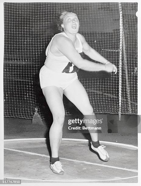 Russia's Tamara Press breaks the women's world record in the discus throw with a throw of 193 feet, six inches in the England-Russia Federal Republic...