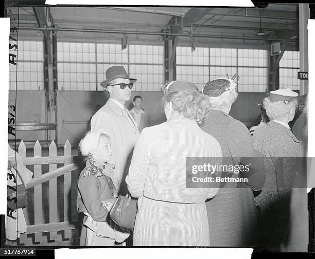 Ousted Soviet U.N. Delegate and family leave on Queen Mary. New York, New York: Aleksander K. Guryanov, attache to the Soviet United Nations...