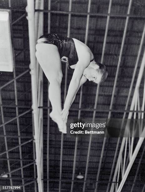 Canadian dive girl in practice. Melbourne, Australia: Canadian diver Irene MacDonald, of Hamilton, Ontario, Jack-Knifes during a training dive at the...