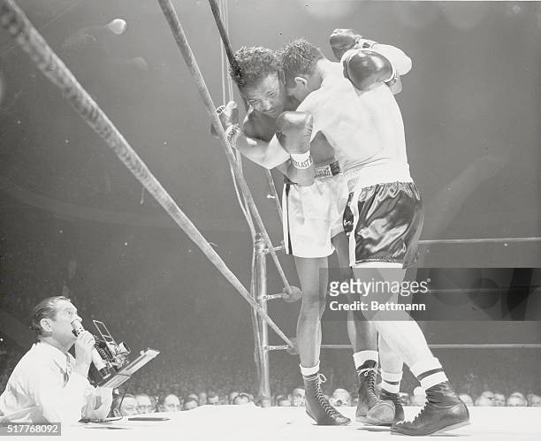 New York: "Name The Game." Contender Gene Fullmer and middleweight champion Sugar Ray Robinson "wrestle" in an early round of their scheduled...