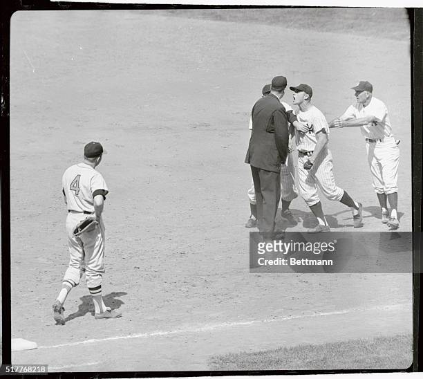 With bulging neck veins showing his anger, New York Yankees' Roger Maris vociferously protests "out" call at 1st base to umpire Al Smith, in 8th...