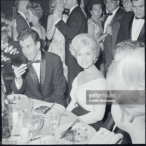 After awards banquet at Beverly Hilton Hotel, Maximilain Schell, who won honors as best actor, with Debbie Reynolds.