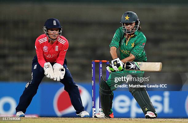 Sana Mir, Captain of Pakistan plays a reverse sweep shot, as Sarah Taylor of England looks on during the Women's ICC World Twenty20 India 2016 match...