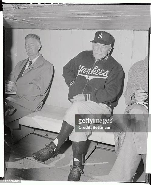 The day was cold and the outlook grim as Casey Stengel, Yankee manager sat in the dugout during batting practice before the start of today's seventh...