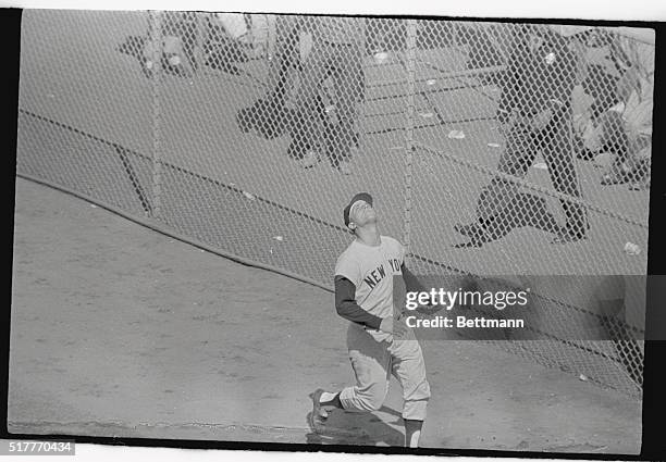 New York Yankees right fielder Roger Maris looks up tp the air as he watches San Francisco Giants first baseman Willie McCavey's home run ball go...