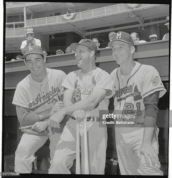 Sandy Koufax, L.A., Stan Musial, St. Louis, and Warren Spahn, Boston Braves of the National League laugh it up before the All-Star Game held at D.C....