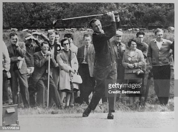 American Arnold Palmer tees off for the 12th hole during the second round of the British Open July 12. The 32-year-old defending champion shot...