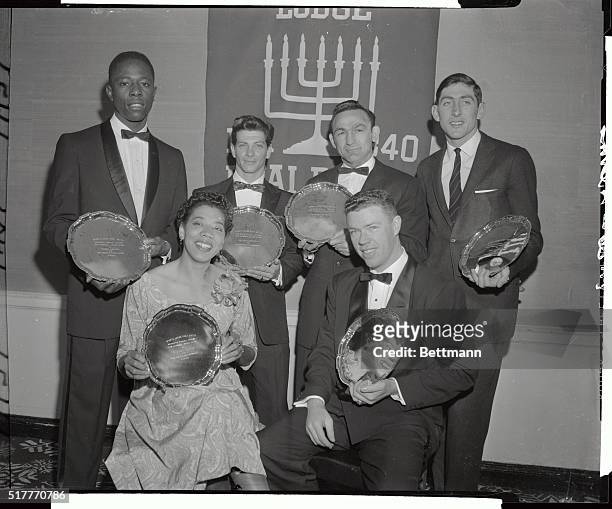 Holding the awards presented to them at the seventh annual awards dinner of the sports lodge of B'nai B'rith are, left to right: Milwaukee Braves'...
