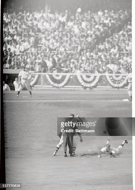 Yankees' Mickey Mantle is a dead duck sliding into second in the first inning of the first world series game at the stadium today. Umpire McKinley...