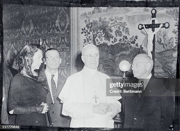 Pope Pius XII poses with American Film Director Cecil B. Demille and his daughter, Cecile, after he received them in private audience at his summer...