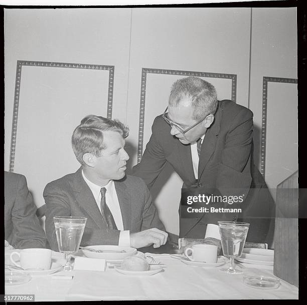 Attorney General Robert F. Kennedy speaks with Labor Secretary W. Willard Wirtz at the 10th anniversary convocation of the Fund for the Republic....