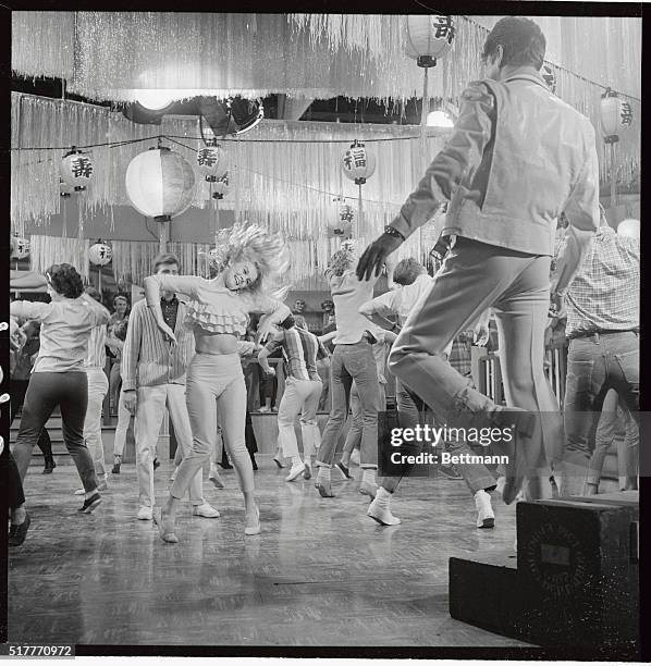 Probably one of the most hectic dance sequences ever captured on film is the "A Lot of Livin' To Do" number from the Columbia Pictures movie version...