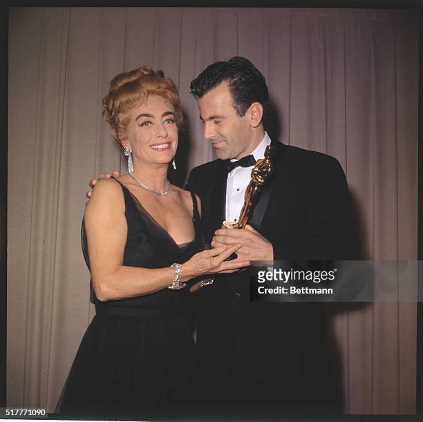 Maximilian Schell and Joan Crawford are shown here as they pose together at the Academy Awards. Schell won Best Actor 1961 for Judgement at Nuremberg.