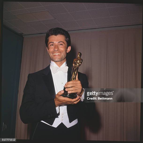 Actor George Chakiris is shown here as he holds his "Oscar."