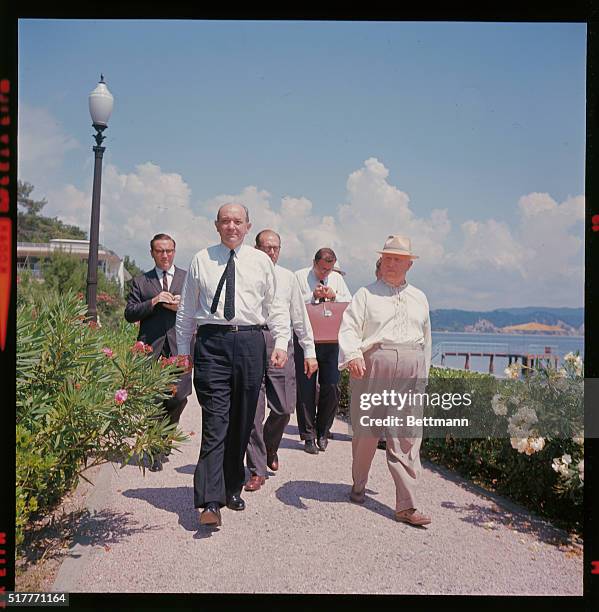 Cagra, U. S. S. R.: Take Garden Stroll. U. S. Secretary Dean Rusk, , and Soviet Premier Nikita Khrushchev, , take a stroll, in shirt sleeves, through...