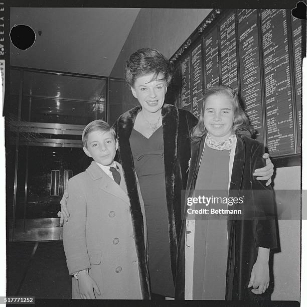 Singer Judy Garland is flanked by her children, Joseph and Lorna, as she arrives at the CBS building here February 9th. Miss Garland, found in a...