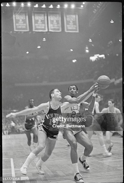 Boston: Knicks' Howard Komives steals ball from Celtics' Sam Jones during 1st period action at Boston Garden. Boston won game, 124-113.