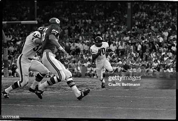 Gale Sayers, #40, Chicago Bears, is shown with the football in a game with the Kansas City Chiefs.