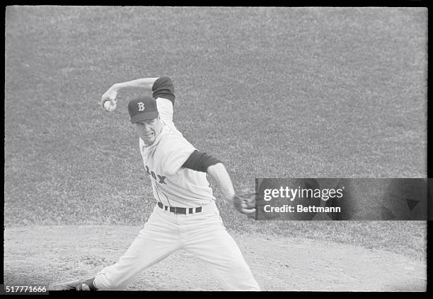 Fenway Park, Boston: Jim Lonborg seems to snarl at the Cardinals' Bob Tolan as he pitches to him following Julian Javier's double with two out in the...