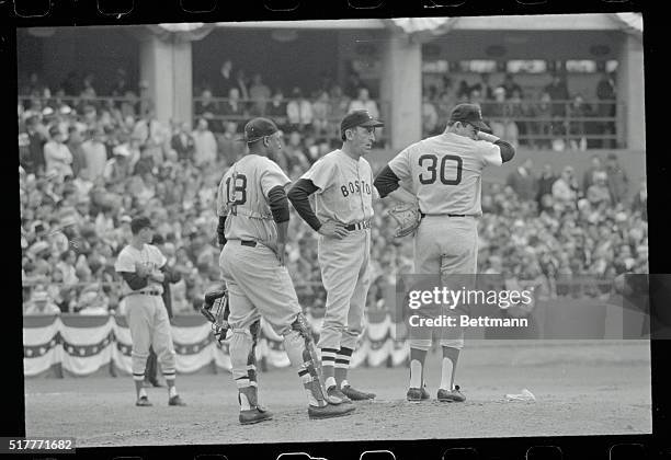 Busch Stadium: Boston's pitching Coach Sal Maglie has just informed Pitcher Jose Santiago that his day's work is over during 4-run 1st inning...