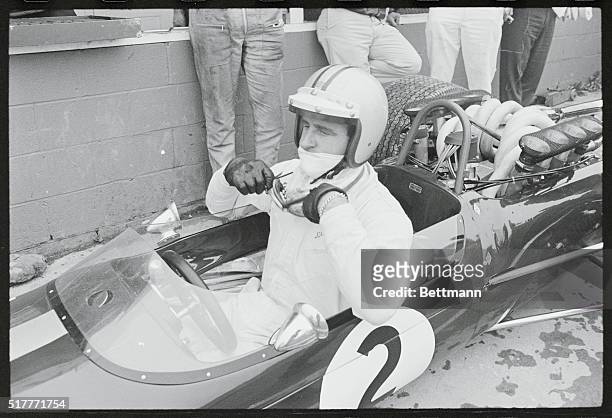 Watkins Glen, New York: New Zealand's Denis Hulme adjusts his goggles before taking a few practice laps around the Watkins Glen Grand Prix course...