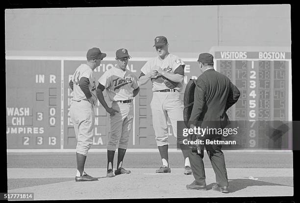 Red Sox-Twins- Boston: Jim Kaat Twins pitcher, talks to his manager Cal Eermer after complaining about a pain in his elbow in the third inning....