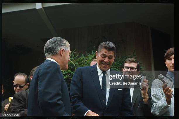 Pacific Palisades, CA: California Governor Ronald Reagan enjoys a laugh in front of his home with Michigan Governor George Romney. September 24th. As...