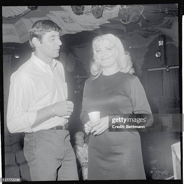 New York Jets backfield star Joe Namath chats with bosomy Jennie Lee who is a star stripper at the Mayfair on West 47th Street off Broadway. Namath...