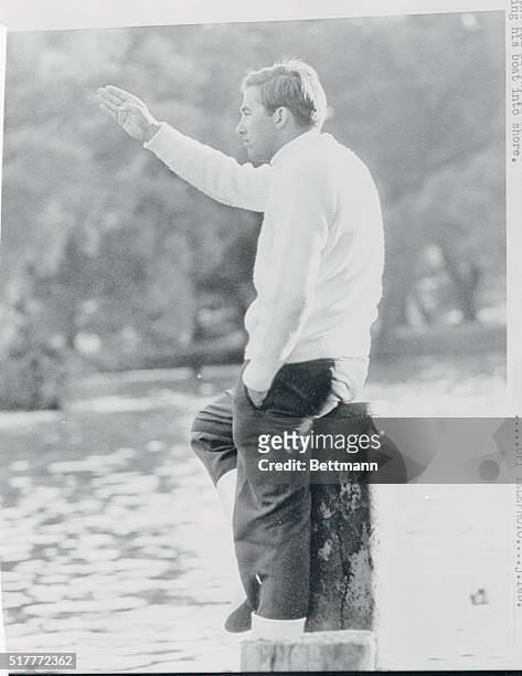 After finishing third in the sixth race in the International Dragon Class World Championships, King Constantine of Greece sits on a post on the end...