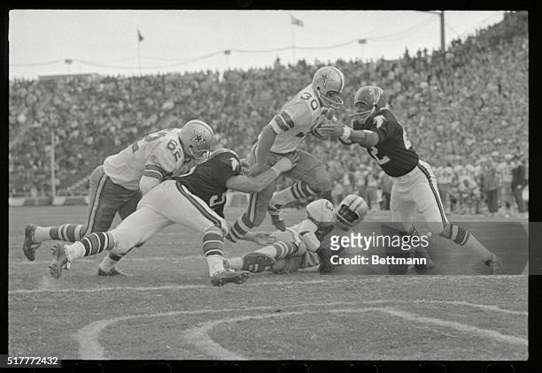 --Dallas: Cowboy running back Dan Reeves powers over Atlanta defenders and scores from one yard out in the final period as the Dallas team defeated...