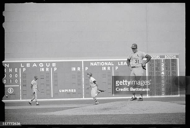 Looks to the Ground. Boston, Massachusetts: St. Louis Cardinal pitcher, Dick Hughes, gazes down at the mound here Oct. 11 as Boston Red Sox Rico...