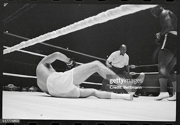 Joe Frazier stands off as Tony Doyle falls to the canvas in the second round 10/17. Referee Zach Clayton signals the knockdown. Seconds after Doyle...