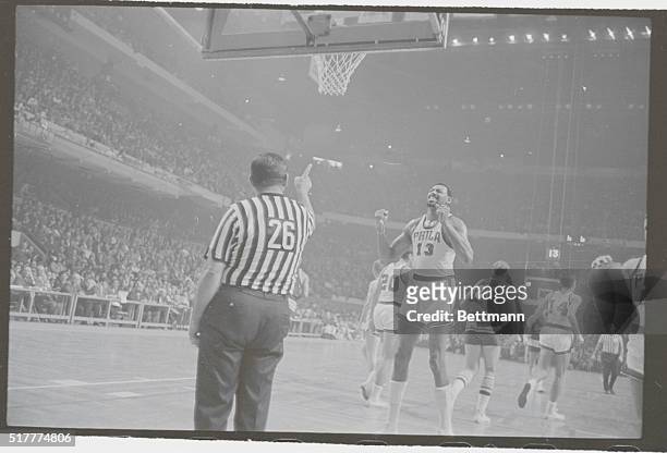 Boston: 76ers' Wilt Chamberlain shows his feelings on call by referee Charles Marino , 4th quarter action, 1st game of doubleheader, Boston Garden....