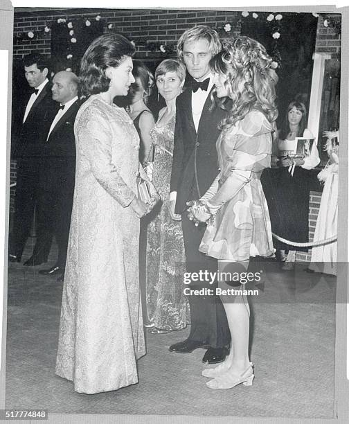 Princess Margaret attends film premiere...Princess Margaret , wearing a full length brocade coat, shakes hands with actress Julie Christie , who is...