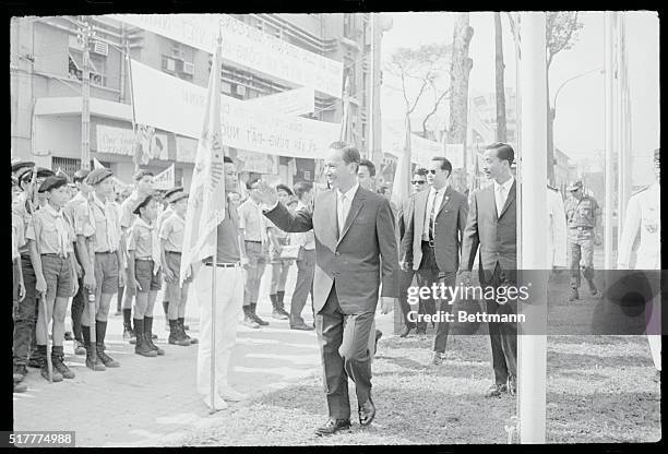 Saigon: New President Nguyen Van Thieu waves to Guard of Honour of Vietnamese Boy Scouts after his inauguration at the National Assembly.