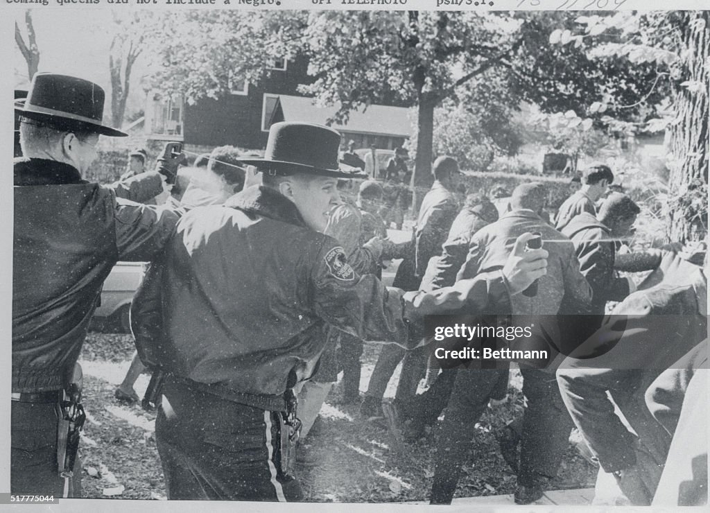 Police Officer Spraying Tear Gas