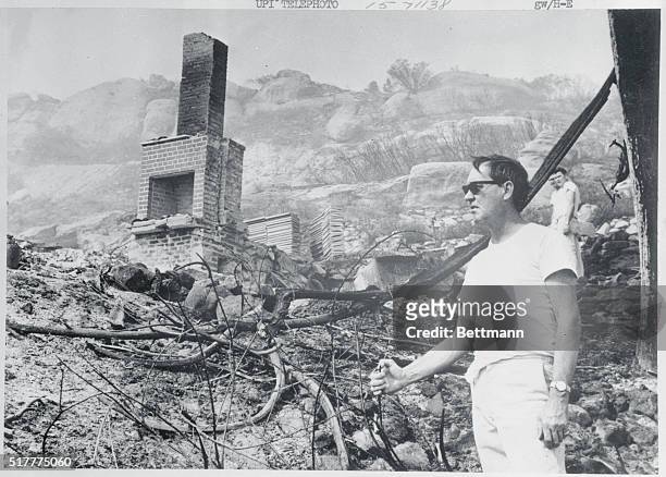 Chatsworth, CA: Bill Kelly looks at the remains of his $20,000 home that was burnt to the ground by the Chatsworth brush fire. Kelly, along with his...