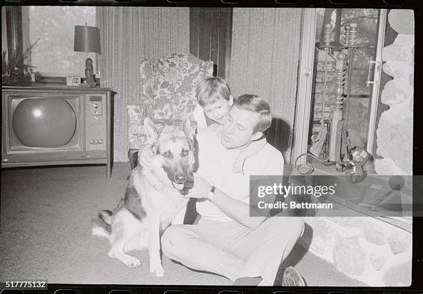 Fran Tarkenton, former Minnesota Vikings quarterback now with the New York Giants, relaxes at home here with his daughter Angela and their dog, Duke....