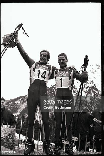 Jean-Claude Killy and Guy Perillat of France rejoice after winning the Mens Downhill event here today at the winter Olympics. They placed 1st and 2nd.