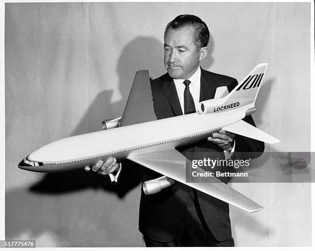 Model of Lockheed's proposed new large luxury jetliner, the L-1011 TriStar is held by Rovert Baily, Lockheed-California Company vice president and...