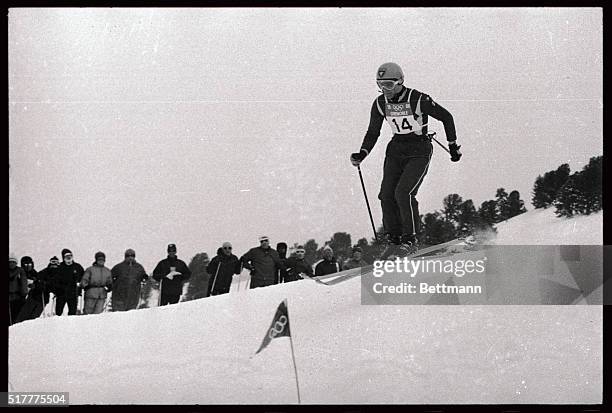 Photo depicts Jean-Claude Killy, French skier, shown on his way to victory in the downhill event.