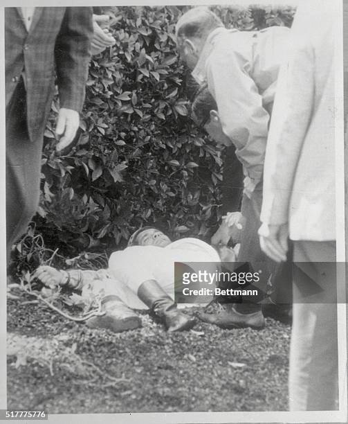 Jockey Bill Shoemaker lies in the paddock at Hollywood Park after being thrown from his mount before the fourth race. Early reports indicated that...