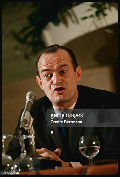 London: American author William Manchester, author of the controversial book, Death of a President, shown with a copy of his latest work, The Arms of...