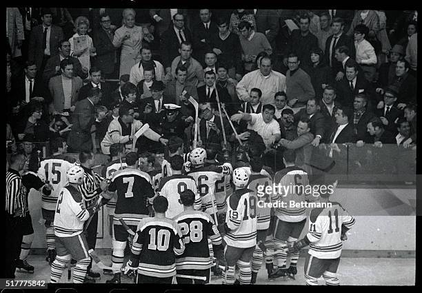 Bobby Orr was knocked out by Leaf's Pat Quinn, second period of the game here at Boston Garden. Fans tried to get at Leafs' Quinn in the penalty box...