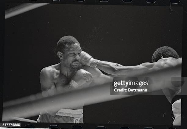 Blow from the glove of world Welterweight challenger Jose Napoles sends Curtis Cokes against the ropes here. Napoles won the match and welterweight...