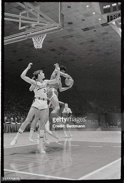 Lew Alcindor of UCLA grabs a rebound away from Jerry johnson of Purdue in the 31st annual NCAA basketball championship game at Freedom Hall.