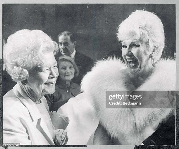 It's smiles all around as actress Ginger Rogers is congratulated by her mother, Lela Rogers, left, backstage at the Theatre Royal late February 20th...