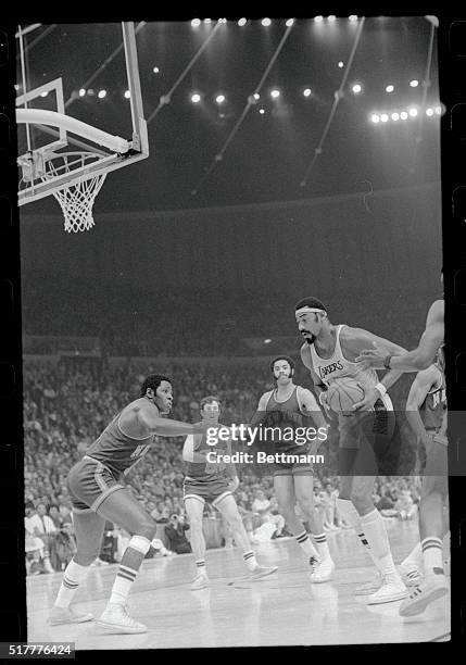 Inglewood, California: Wilt Chamberlain takes the ball out of the hands of Willis Reed and goes in to score for the Lakers. The Lakers defeated the...